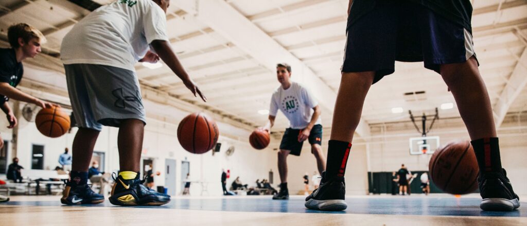 Basketball players practicing during a private lesson